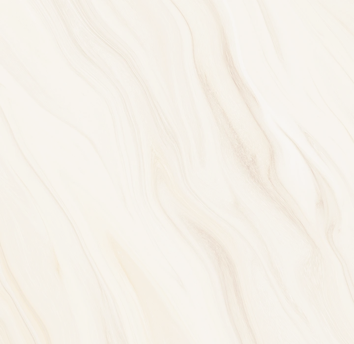 A close-up background texture featuring a smooth, matte marble surface with soft tan and grey veining.